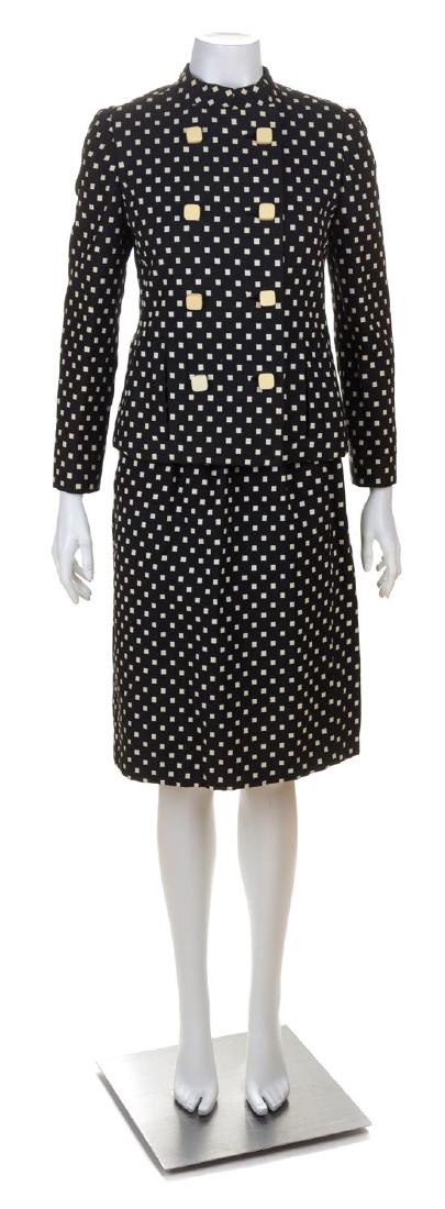 * A Donald Brooks Black and White Pattern Skirt Suit,: * A Donald Brooks Black and White Pattern Skirt Suit, comprised of a double breasted jacket with a mandarin collar, front welt pockets and decorative square button closure; together with a matching pe