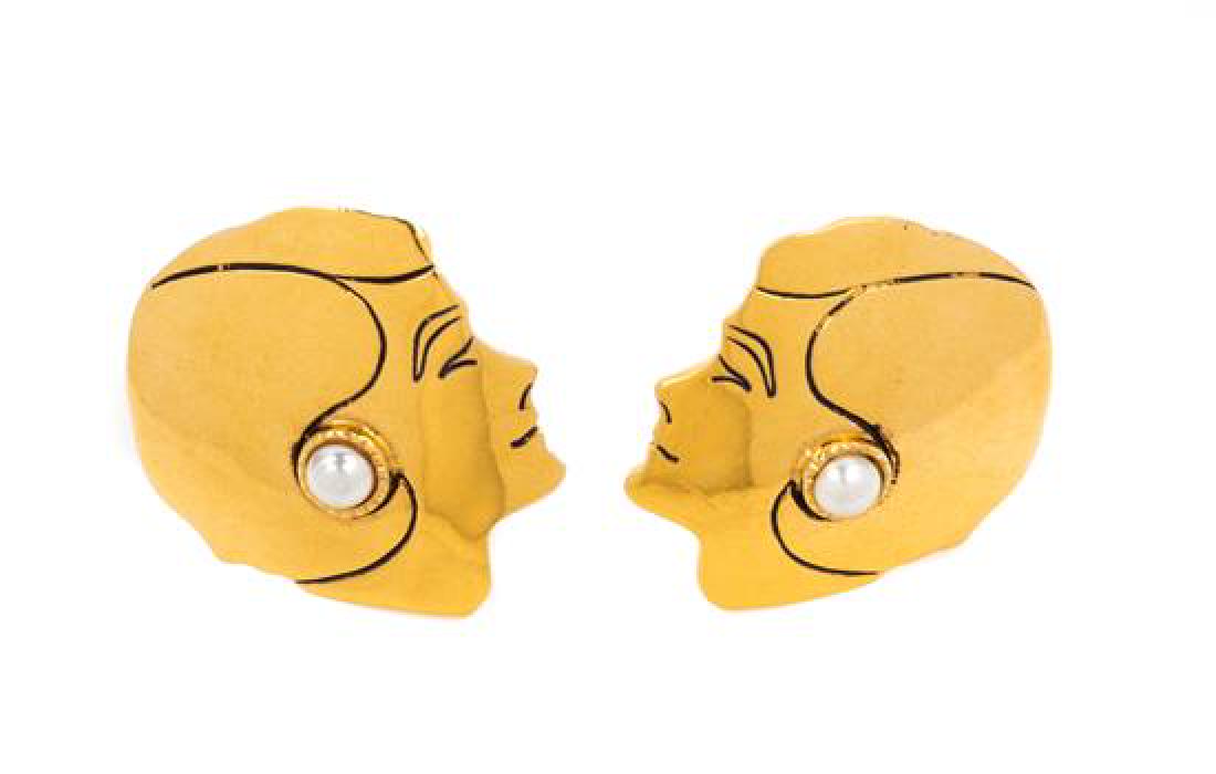 * A Pair of Chanel Goldtone Face Earclips, 1.25" x 2".: * A Pair of Chanel Goldtone Face Earclips, with a silhouette of Coco Chanel and a decorative pearl earclip. Stamped: Chanel. 1.25" x 2". Estimate $150-250 Property from the Estate of Mrs. Betty Marcus