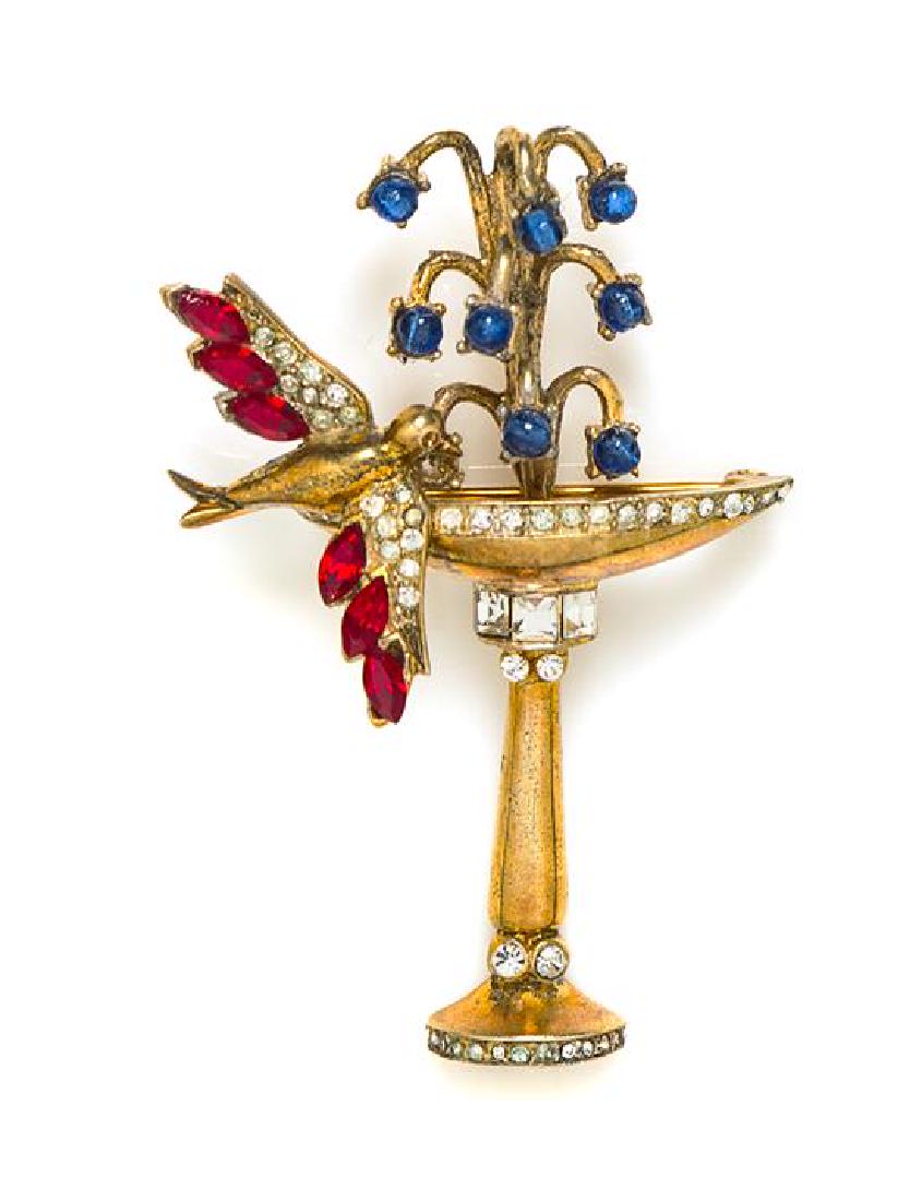 A Coro Bird Bath Brooch, 2.75" x 2".: A Coro Bird Bath Brooch, goldtone with decorative rhinestone embellishment. Stamped: Coro. 2.75" x 2". Estimate $100-150 Overall very good condition. Light tarnishing and verdigris. The stated ove