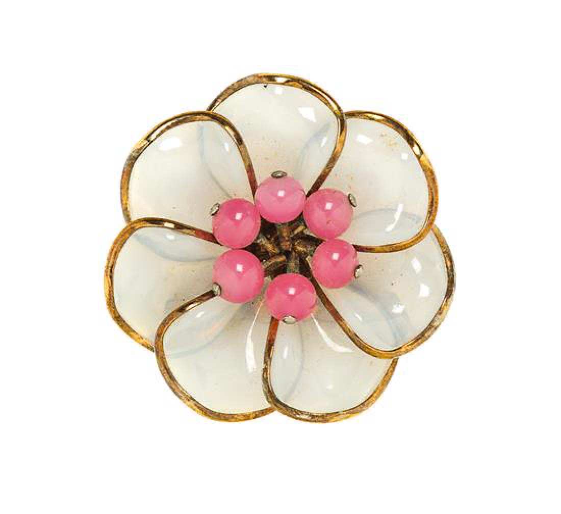 A Trifari Poured Glass Floral Brooch, 2" x 2".: A Trifari Poured Glass Floral Brooch, 1950s, goldtone with opaque glass petals and small pink beads. Stamped: Crown Trifari. 2" x 2". Estimate $60-80 Overall good condition. Slight tarnish and verdigr
