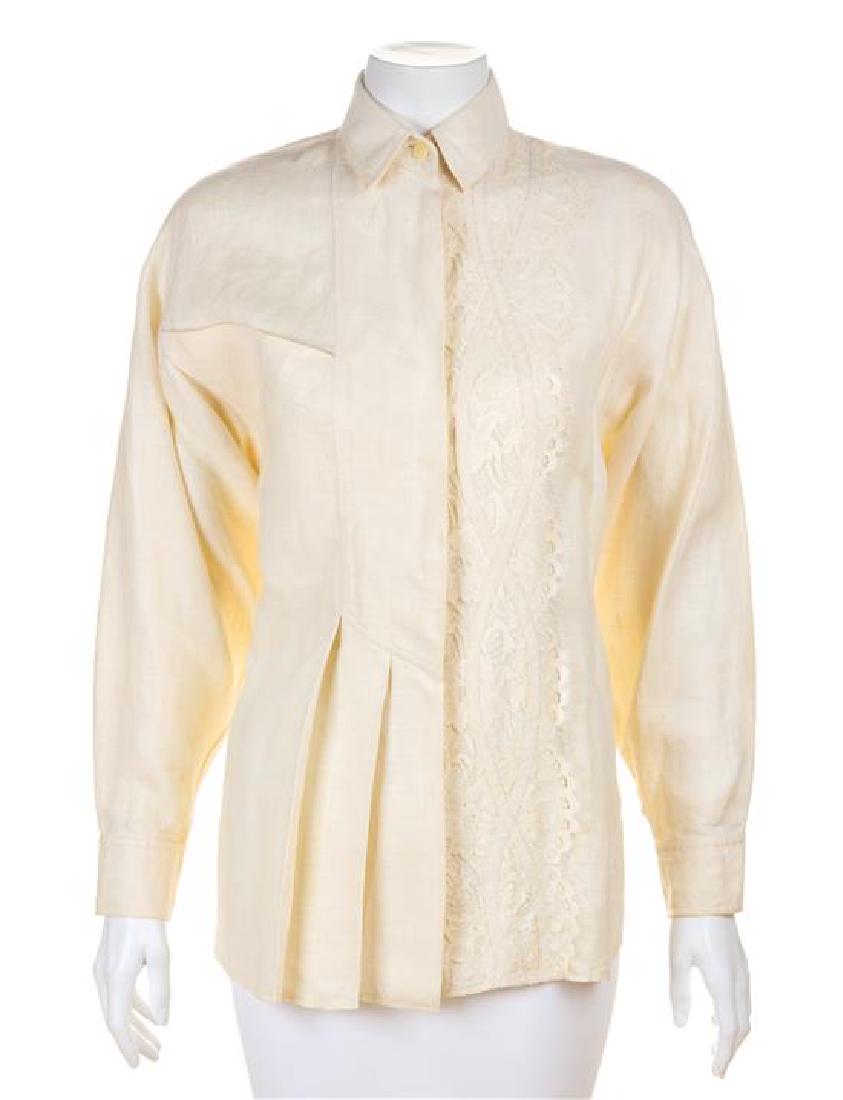* A Koos Cream Linen Blouse, Size small.: * A Koos Cream Linen Blouse, with a flat collar, a single chest patch pocket, decorative lace on the left front and hidden button front closure. Labeled: Koos. Size small. Estimate $80-120 Property fr