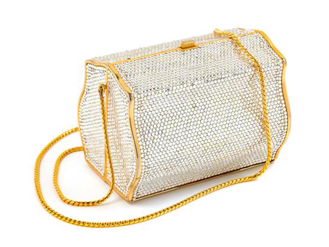 A Judith Leiber Crystal Box Minaudiere, 5" x 3.5" x: A Judith Leiber Crystal Box Minaudiere, with goldtone hardware, a push button top closure, an optional top handle and a chain shoulder strap. Together with a dust bag. Stamped: Judith Leiber. 5" x 3.5