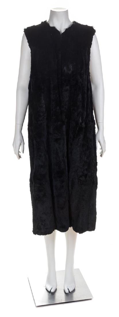 A Black Sheared Fur Vest, No size.: A Black Sheared Fur Vest, with a round neckline, an open front and fully lined. Unlabeled. No size. Estimate $80-120 Overall good condition. Interior buttons indicate that it was used for a lining.