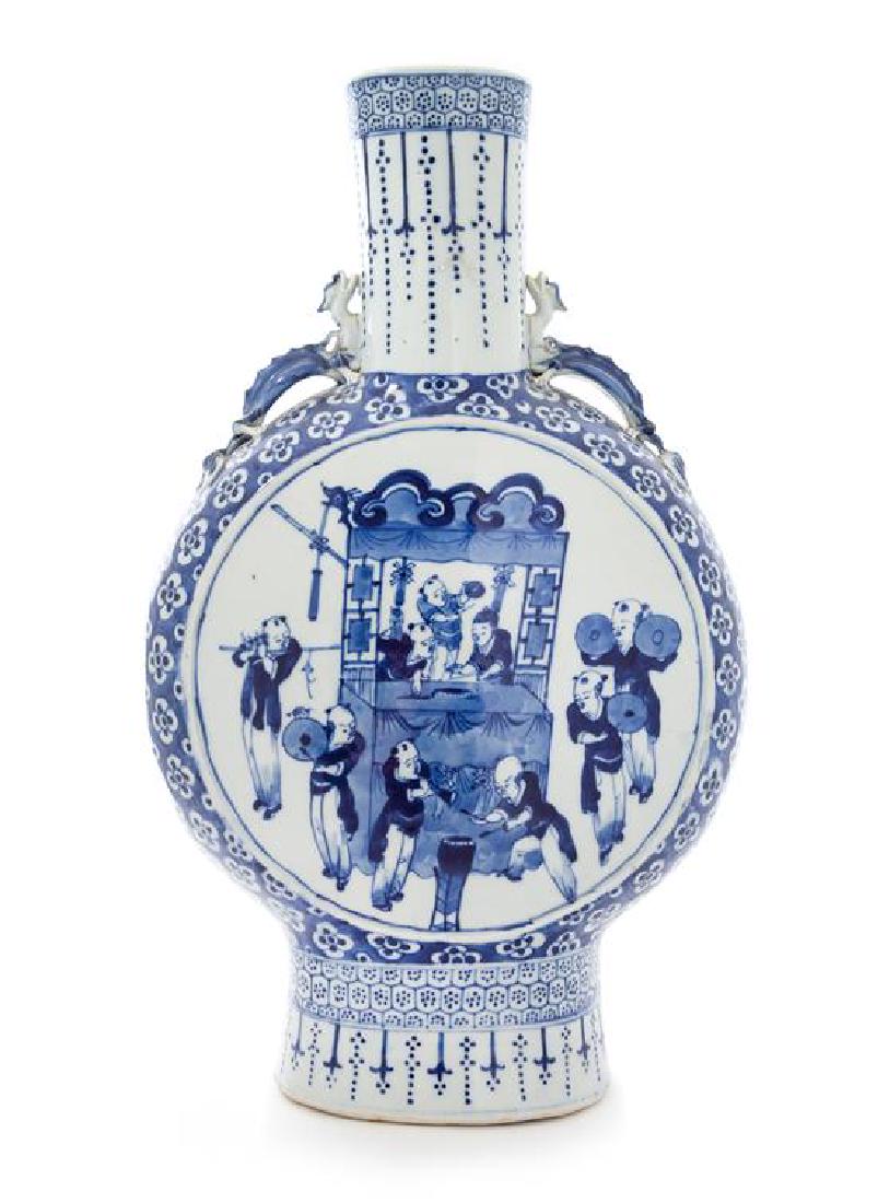 A Large Blue and White Porcelain Mook Flask Height 18: A Large Blue and White Porcelain Mook Flask 19th century the circular body painted with a large roundel showing children at play, divided by various prunus heads against a cobalt blue ground, raised o