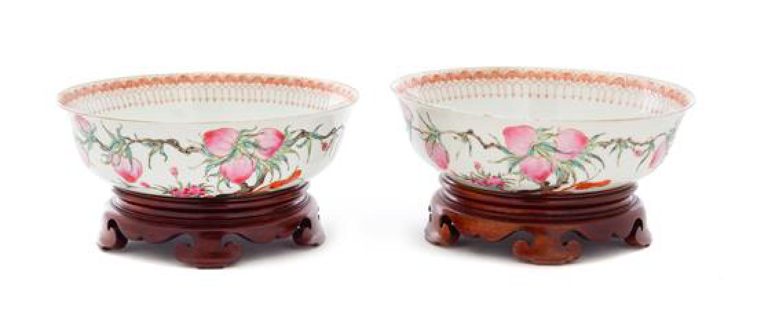 A Pair of Iron Red and Famille Rose Porcelain Bowls: A Pair of Iron Red and Famille Rose Porcelain Bowls republic period each having rounded walls, painted to the exterior depicting peach branches, floral sprays and lingzhi sprigs, the interior decorate