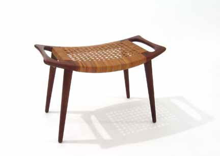HANS J. WEGNER, (DANISH B.1914), 'Papa Bear' foot: HANS J. WEGNER (DANISH B.1914) 'Papa Bear' foot stool Model JH, teak. H: 16, W: 27 1/2, D: 16 in. PROVENANCE: Collection of Reese and Marilyn Palley