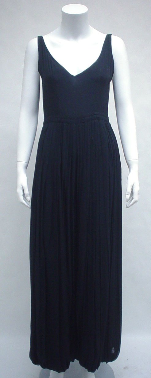 Guy Laroche black silk pantaloon dress, 1970s, Ca: Guy Laroche black silk pantaloon dress 1970s Camisole top with dramatic knife-pleated split skirt, lined in silk with a back zip and hidden snaps. Labeled Guy Laroche Paris / Made in France with "3989