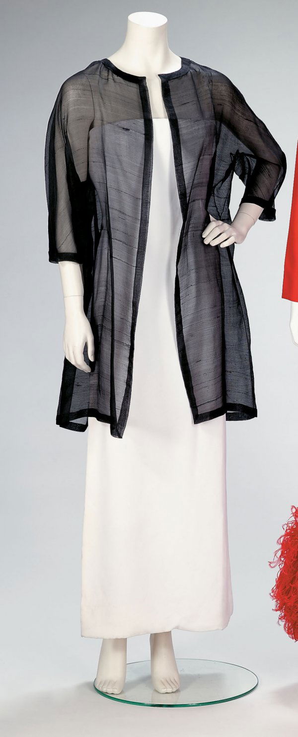 Guy LaRoche couture sheer black silk opera coat: Guy LaRoche sheer black silk coat 1960s-70s In very sheer textured raw silk with open front, collarless, handfinished on all edges. Labeled Guy Laroche Paris" with "4594" handwritten verso."