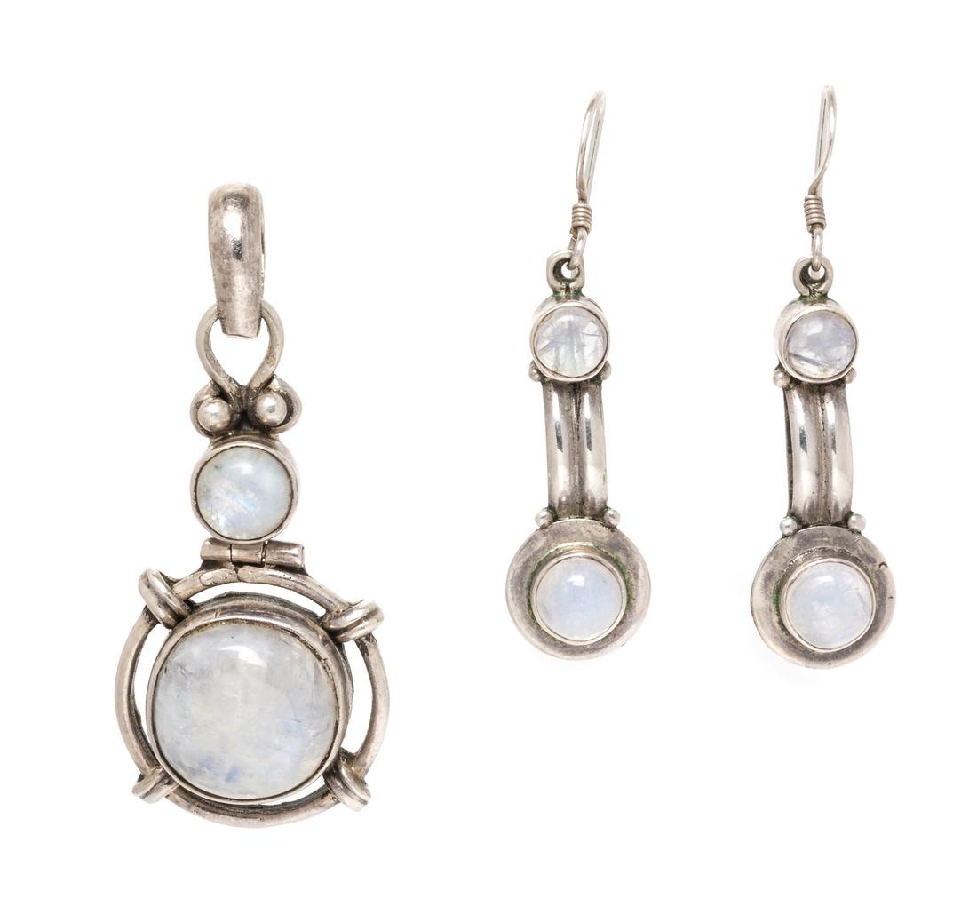*A Collection of Sterling Silver and Moonstone Jewelry: A Collection of Sterling Silver and Moonstone Jewelry, consisting of a pendant containing two round cabochon cut moonstone measuring approximately 7.59-15.50 mm diameter together with a pair of earrin