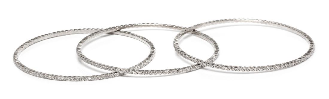 *A Collection of Sterling Silver and Diamond Bangle (1 of 1)