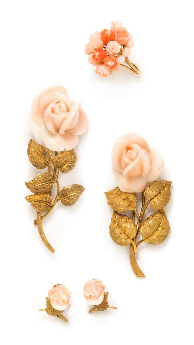 *A Collection of Yellow Gold and Angel Skin Coral: A Collection of Yellow Gold and Angel Skin Coral Floral Motif Jewelry, consisting of a pair of screwback earrings containing angel skin coral carved flowers and textured gold leaves, a pair of 18 kara