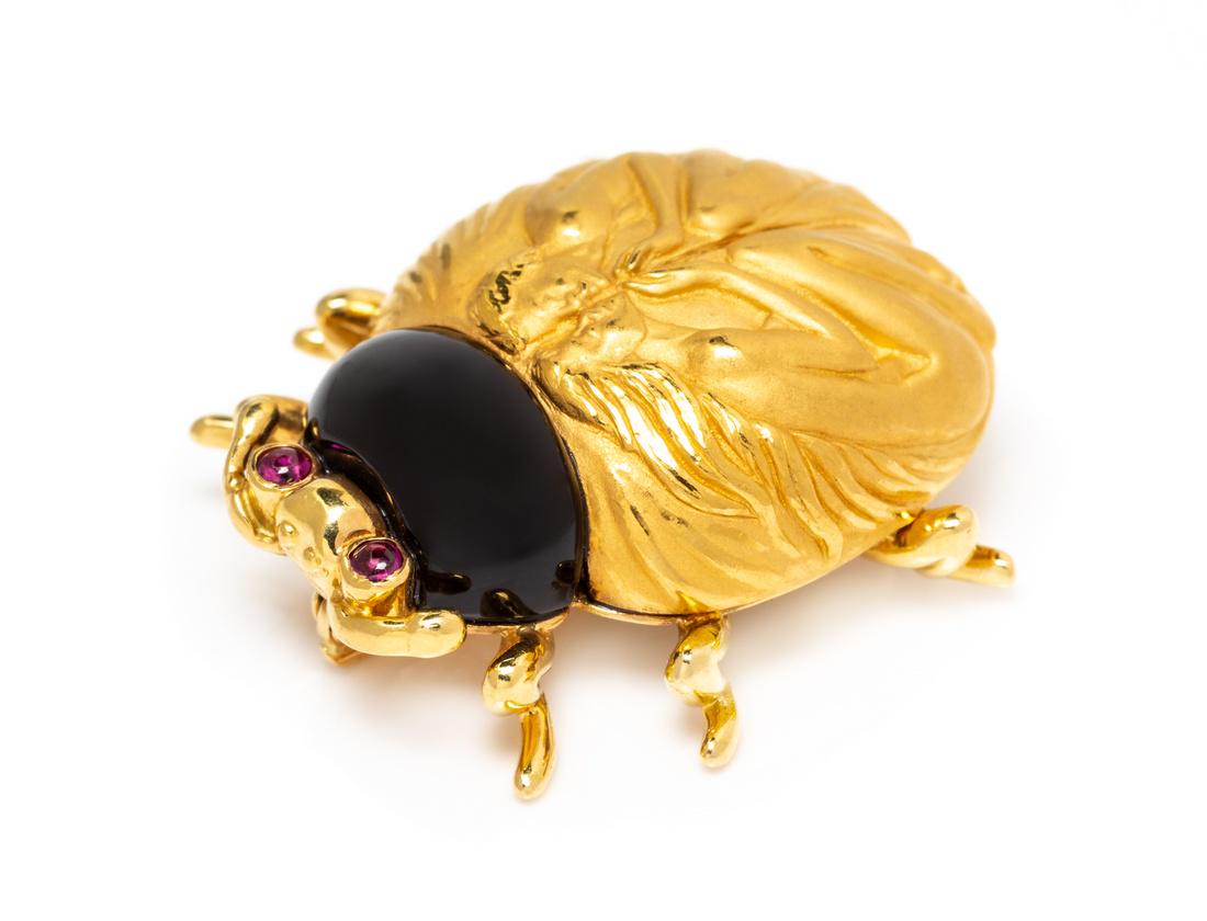 An 18 Karat Yellow Gold, Onyx and Garnet Love Bug (1 of 1)
