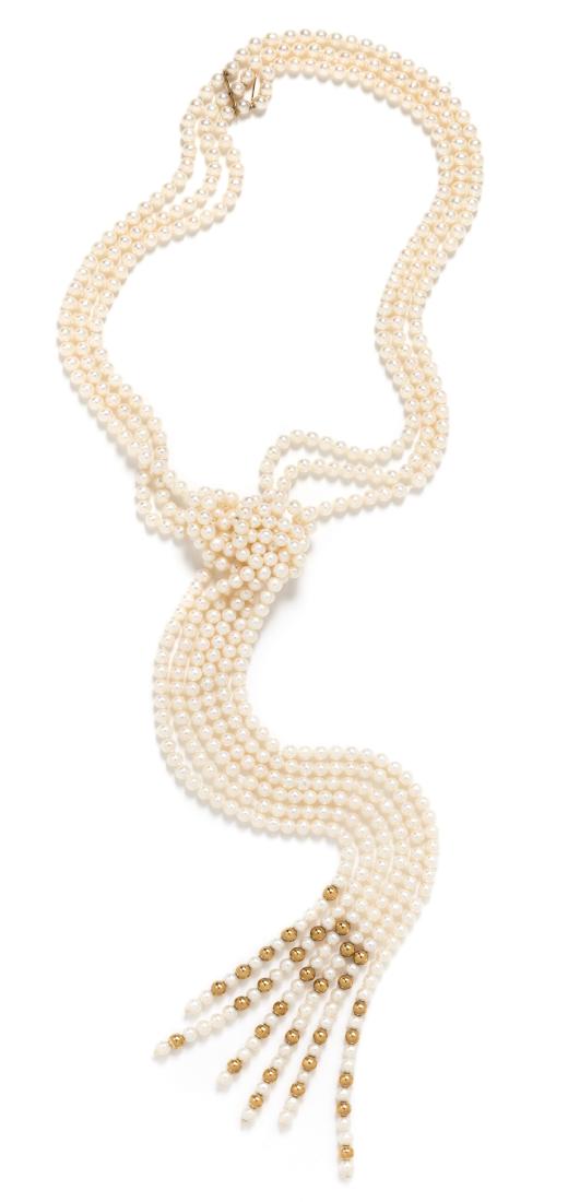 *An 18 Karat Yellow Gold and Cultured Pearl Lariat: An 18 Karat Yellow Gold and Cultured Pearl Lariat Necklace, Angela Cummings, consisting of three strands containing numerous pearls measuring approximately 4.85 mm in diameter and 30 gold beads measur