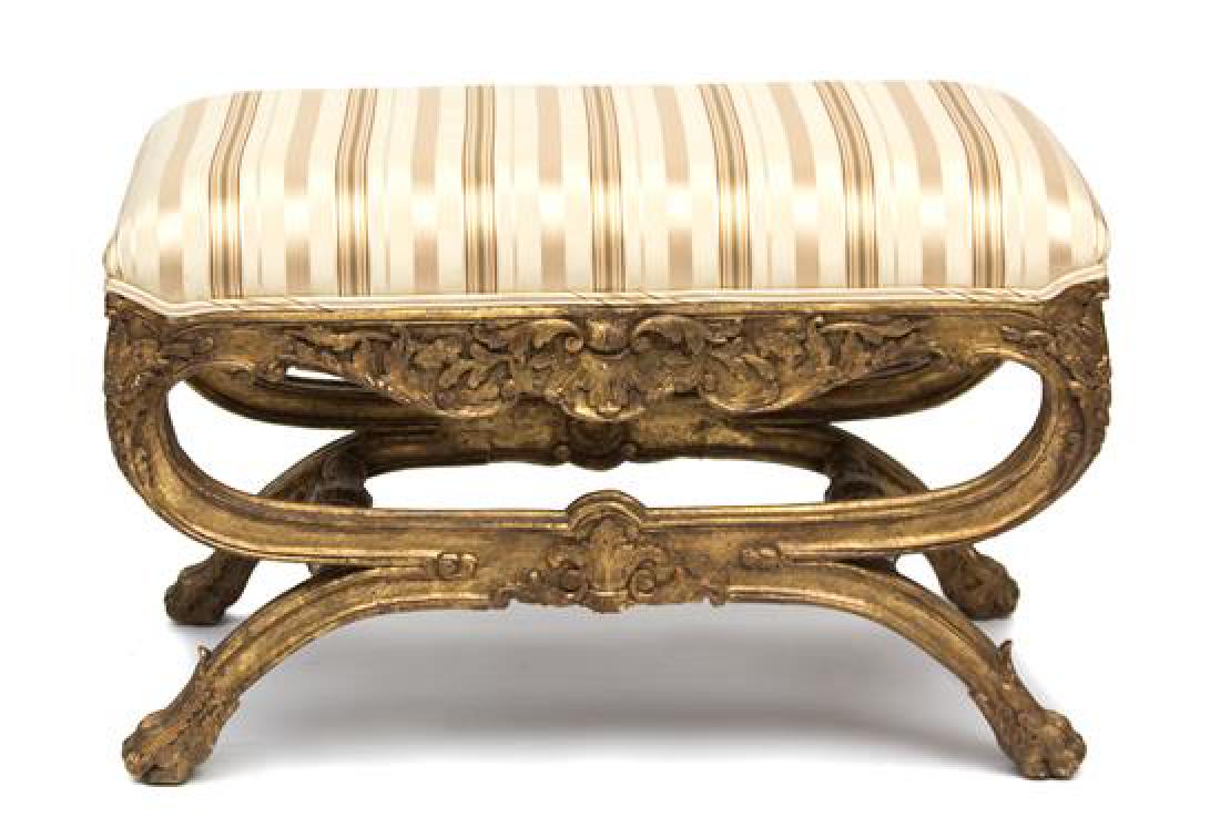 An Italian Rococo Style Painted and Parcel Gilt: An Italian Rococo Style Painted and Parcel Gilt Curule-Form Tabouret Early 20th century Height 20 inches. Estimate $200-400 Nicks to feet, condition commensurate with age.