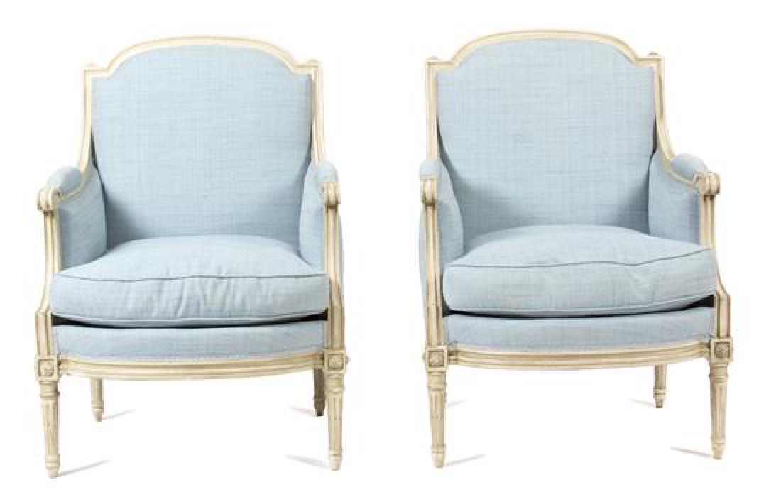 A Pair of Louis XVI Style Carved and Painted Bergeres: A Pair of Louis XVI Style Carved and Painted Bergeres late 19th century Height 36 1/2 inches. Estimate $400-600 Minor losses to paint, overall excellent condition.
