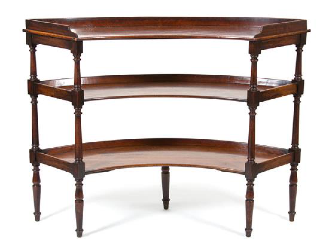A Regency Style Mahogany Three-Tier Curved Serving: A Regency Style Mahogany Three-Tier Curved Serving Board 20th century Height 40 1/2 x width 53 x depth 19 1/2 inches. Estimate $400-600 Minor surface scratching and water ring evidence, aged purposefu