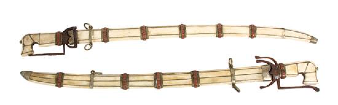 Two Middle-Eastern Ornamental Swords Length 36 inches.: Two Middle-Eastern Ornamental Swords 19th century having bone inlaid, metal and coral stone mounted sheathes, steel blades. Length 36 inches. Estimate $200-300
