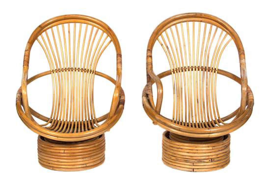 A Pair of Barrel-Back Rattan Armchairs on Swivel Bases: A Pair of Barrel-Back Rattan Armchairs on Swivel Bases 20th century Height 40 inches. Estimate $150-250 Property from H.R.H. Princess Maria Pia of Bourbon-Parma, Palm Beach, FL