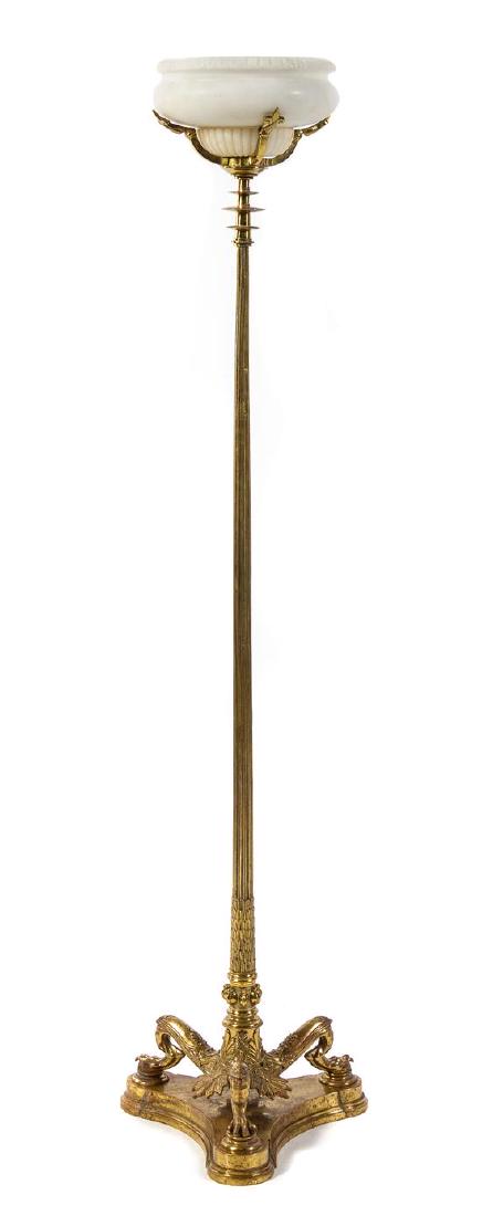 A Neoclassical Gilt Bronze and Alabaster Torchere: A Neoclassical Gilt Bronze and Alabaster Torchere early 20th century the fluted cylindrical standard supporting the lobed alabaster shade, raised on a tripartite base ending in paw feet above a confor