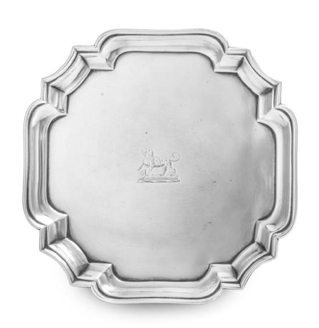 A George II Silver Salver, John Tuite, London, 1734, of: A George II Silver Salver John Tuite, London, 1734 of square form with canted corners, the field centered by an engraved crest depicting a hound passant, raised on pad feet. marked for Sterling on und