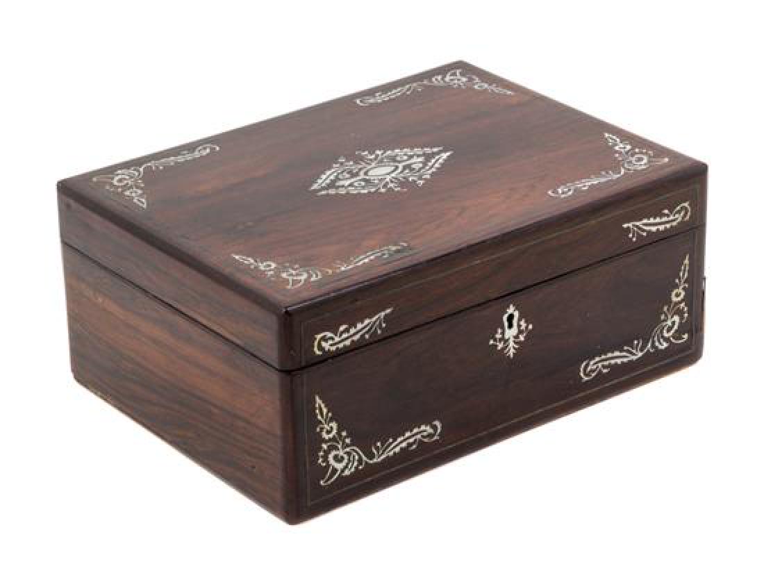 A Regency Mother-of-Pearl Inlaid Rosewood Sewing Casket: A Regency Mother-of-Pearl Inlaid Rosewood Sewing Casket second quarter 19th century the exterior inlaid with floral and foliate decoration, the lid opening to a compartmented liner lifting up to a vac