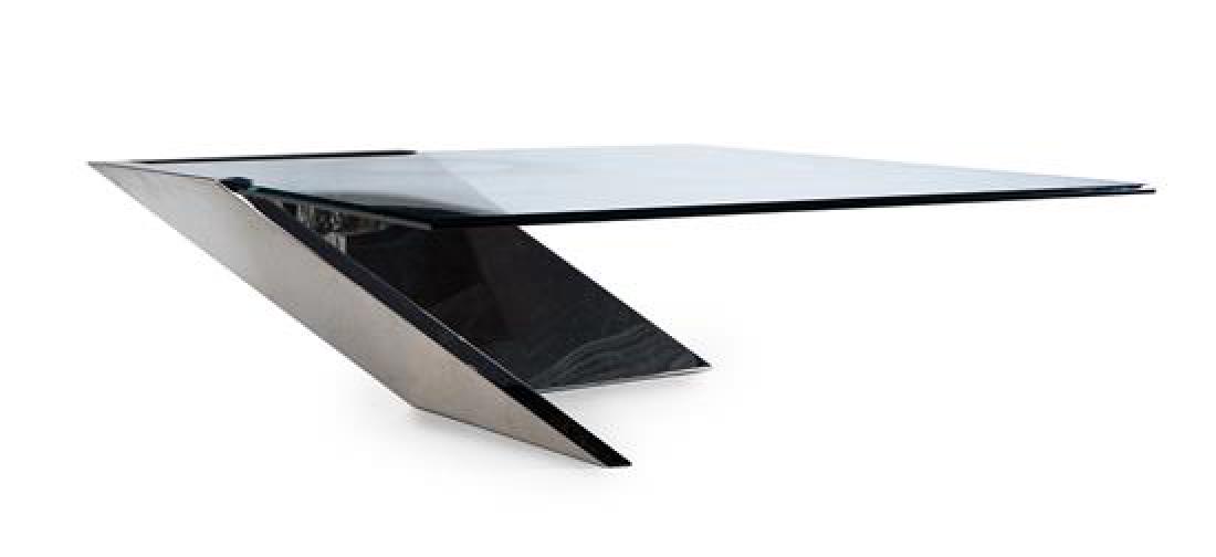 * Brueton, c. 1985, a cantilevered cocktail table: * Brueton c. 1985 a cantilevered cocktail table chromed metal and glass Height 14 1/2 x width 42 x depth 43 inches. Estimate $500-700