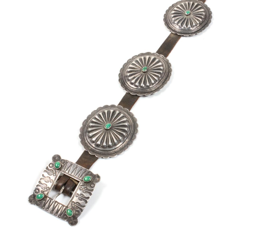 Silver and Turquoise Concho Belt Length 38 inches: Silver and Turquoise Concho Belt having eight oval conchos, each with single turquoise cabochon and a square buckle with four turquoise cabochons. Length 38 inches Estimate $400-600
