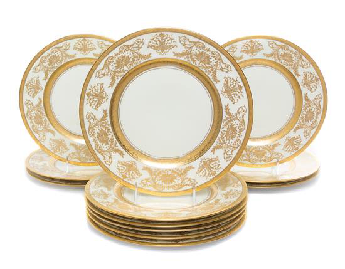 A Set of Twelve Royal Bavarian Hutschenreuther Gilt: A Set of Twelve Royal Bavarian Hutschenreuther Gilt Porcelain Plates Diameter 10 5/8 inches. Estimate $100-200 in good condition overall; light to moderate wear, most significant in spots along inner 