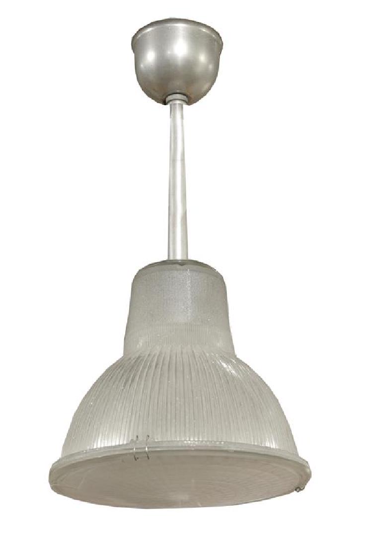 A Set of Three Industrial Holophane Pendants 11" W x: A Set of Three Industrial Holophane Pendants france, circa 1960 Glass 11" W x 11" D x 22" H Estimate $500-700
