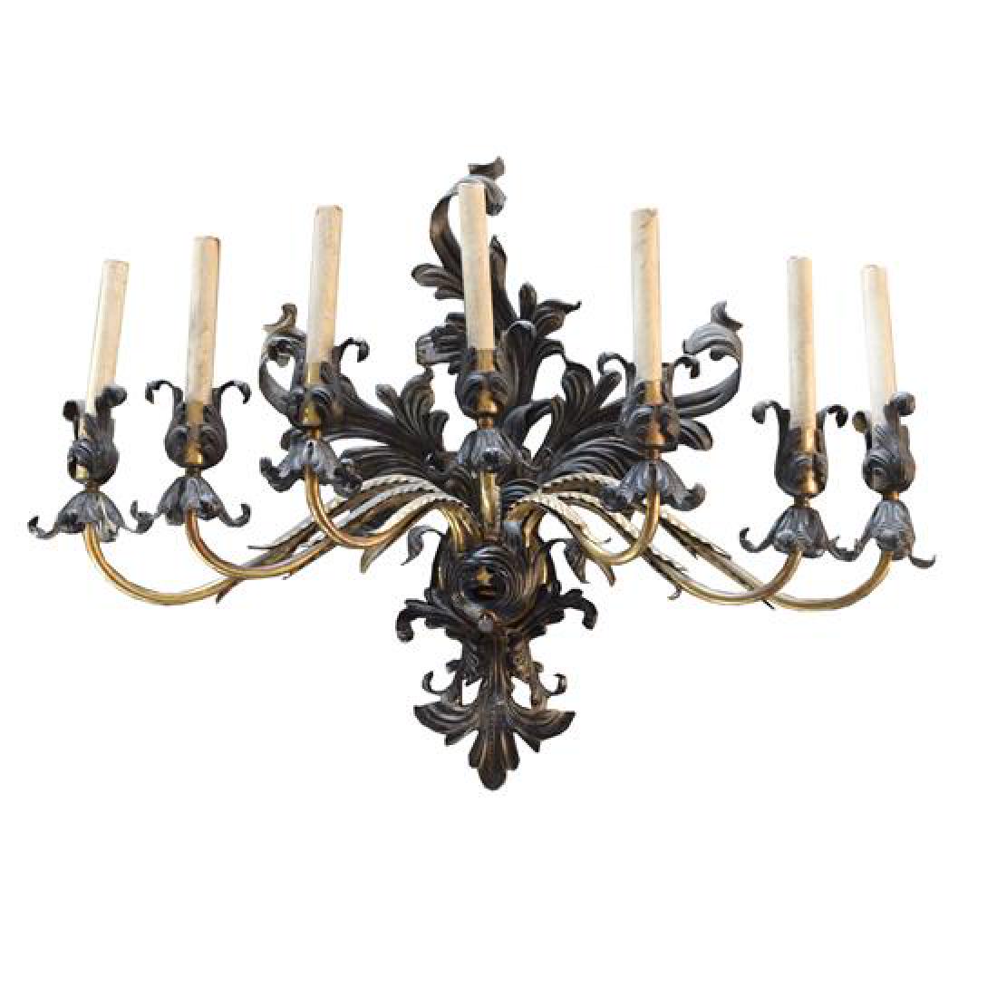 A Brass and Iron Seven Arm Wall Sconce, United States,: A Brass and Iron Seven Arm Wall Sconce United States, Circa 1930 31" W x 11" D x 25" H Estimate $300-500