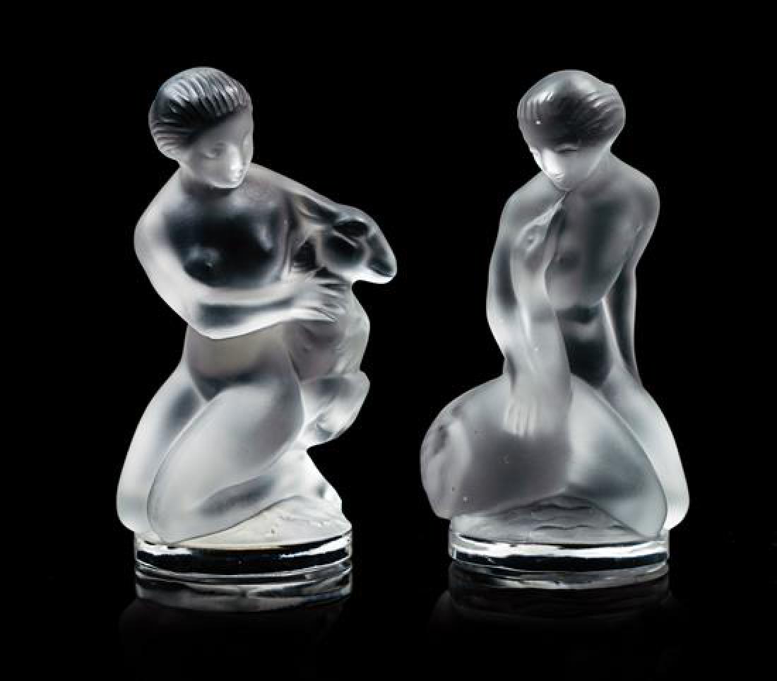A Pair of Lalique Frosted Glass Figures Height 4 1/2: A Pair of Lalique Frosted Glass Figures each depicting a nude, crouching woman. Height 4 1/2 inches. Estimate $150-250 Property from an Estate, Edina, Minnesota