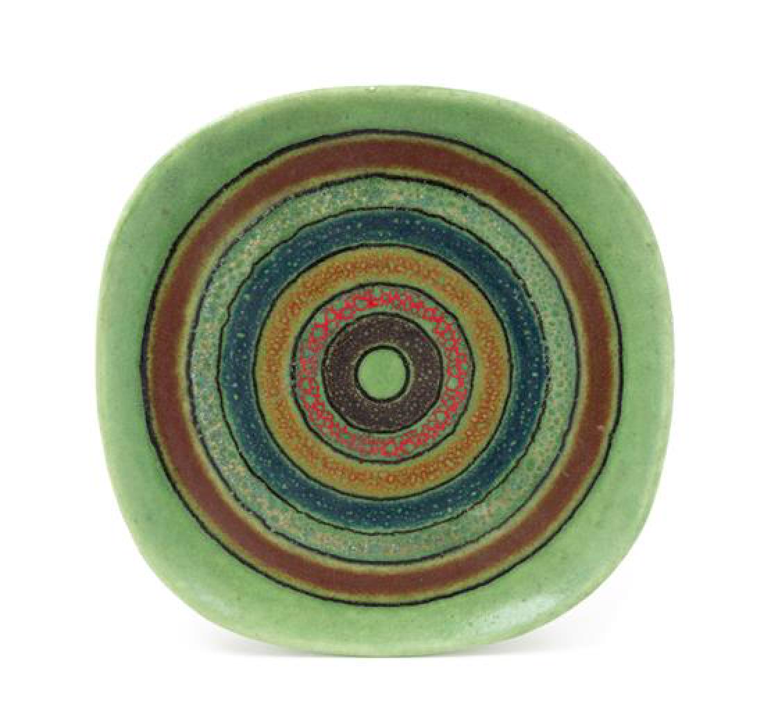 Guido Gambone, (Italian, 1909-1969), Bitossi, c. 1960s: Guido Gambone (Italian, 1909-1969) Bitossi, c. 1960s charger glazed stoneware signed Gambone Italy to underside Height 1 x diameter 11 1/4 inches Estimate $200-400 Overall good condition. Free of any