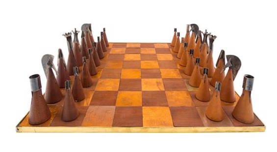 * Attributed to Paul Lobel, (American, 1899-1983),: * Attributed to Paul Lobel (American, 1899-1983) chess set paired with a German game board 32 items total teak, silver, copper Board: 16 x 16 inches Estimate $3,000-5,000 Property from the Estate of