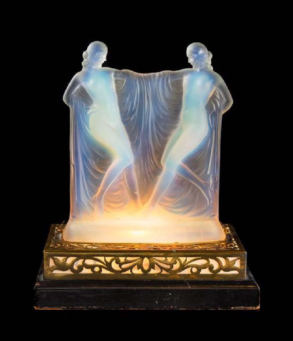 Sabino, France, Early 20th Century, opalescent figures: Sabino France, Early 20th Century opalescent figures on illuminated base glass, gilt metal, wood Height of glass 8 1/2 inches Estimate $800-1,200