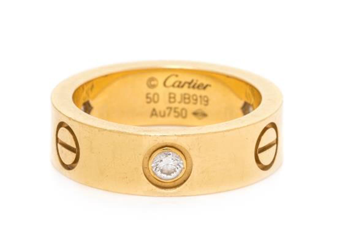 An 18 Karat Yellow Gold and Diamond 'Love' Ring, (1 of 1)