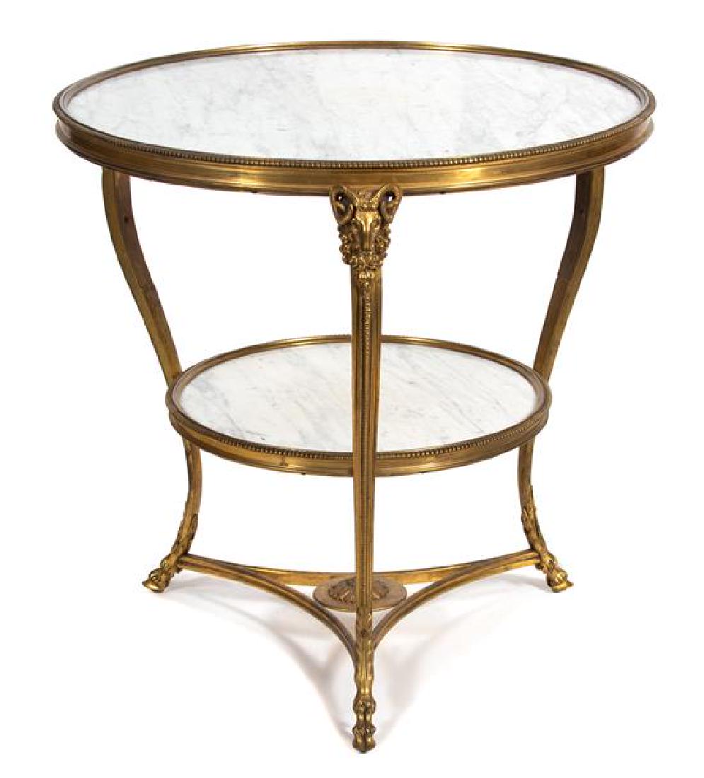 An Empire Style Gilt Bronze Guéridon Height 27 1/2 x: An Empire Style Gilt Bronze Guéridon 20th century Height 27 1/2 x diameter of top 28 inches. Estimate $1,500-2,500