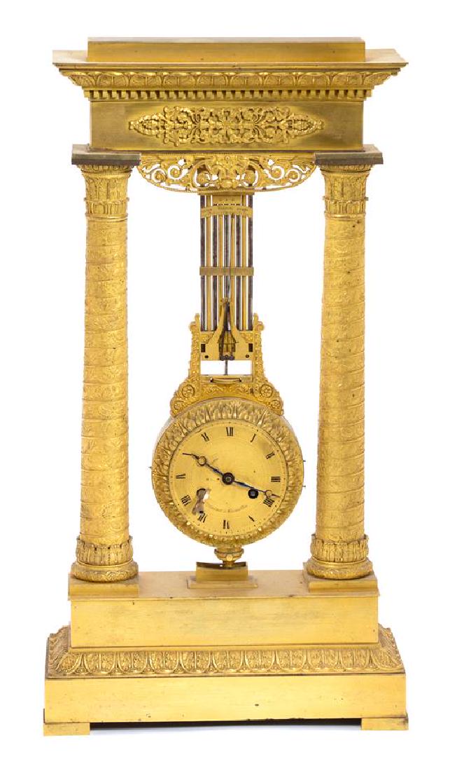 An Empire Gilt Bronze Clock Height 22 inches. (1 of 1)