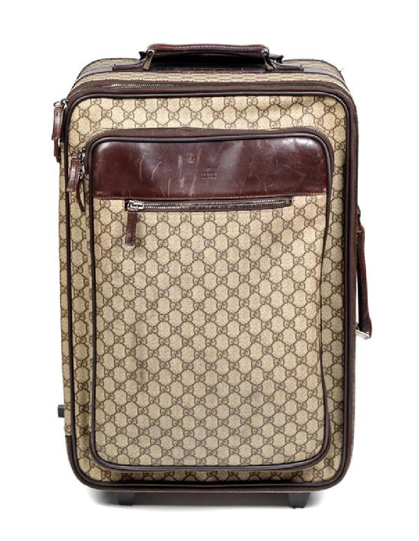 * A Gucci Monogram Canvas Roller Suitcase, 22" H x (1 of 3)