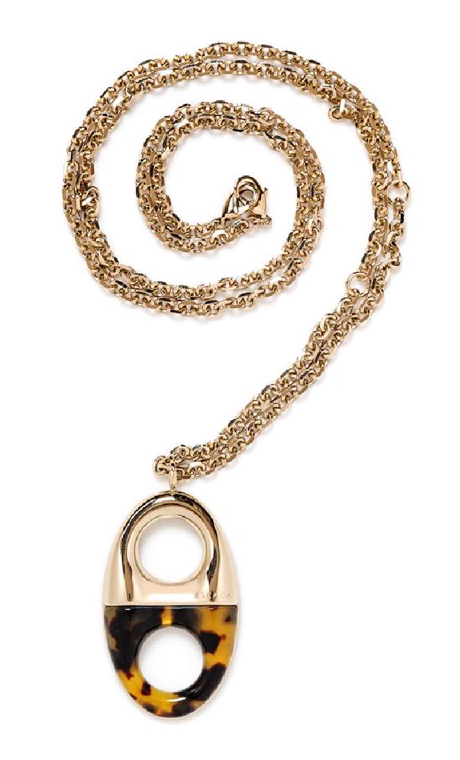 An Escada Goldtone and Faux Tortoiseshell Long Pendant: An Escada Goldtone and Faux Tortoiseshell Long Pendant Necklace, with an adjustable goldtone chain with double lobster clasps. Together with a dust bag. Stamped: Escada. Length: 44"; Pendant: 3" L x 1
