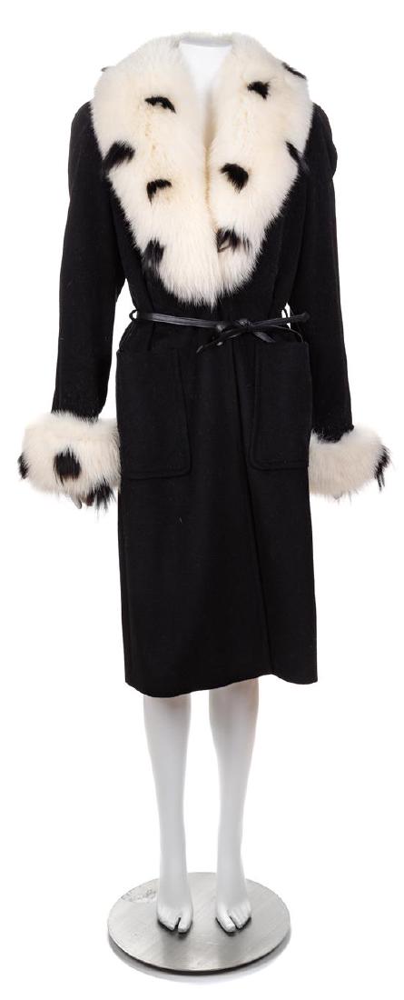 An Escada Black Wool Fox Trim Coat, Size 36; Self-tie: An Escada Black Wool Fox Trim Coat, with a removable fox shawl collar and cuffs, front patch pockets, two button front closure and a removable self-tie leather belt. Labeled: Escada. Size 36; Self-tie