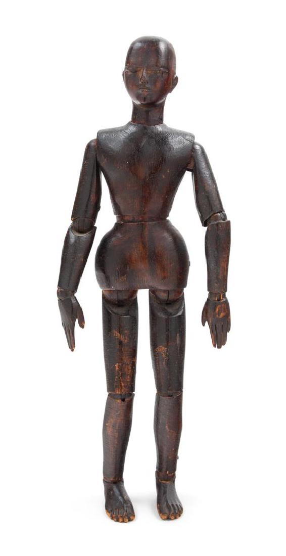 * A Chinese Hardwood Model of a Male Height 13 inches.: * A Chinese Hardwood Model of a Male the figure depicted standing with both hands lowered. Height 13 inches. Estimate $400-600 Property from the Estate of William Lipton, New York, New York