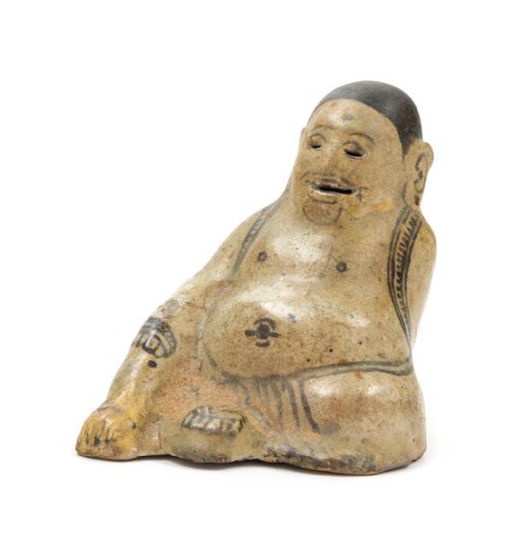* A Rare Thai Pottery Figure of a Buddha Height 5: * A Rare Thai Pottery Figure of a Buddha the figure depicted seated, the face with a smile. Height 5 inches. Estimate $500-700 Property from the Estate of William Lipton, New York, New York