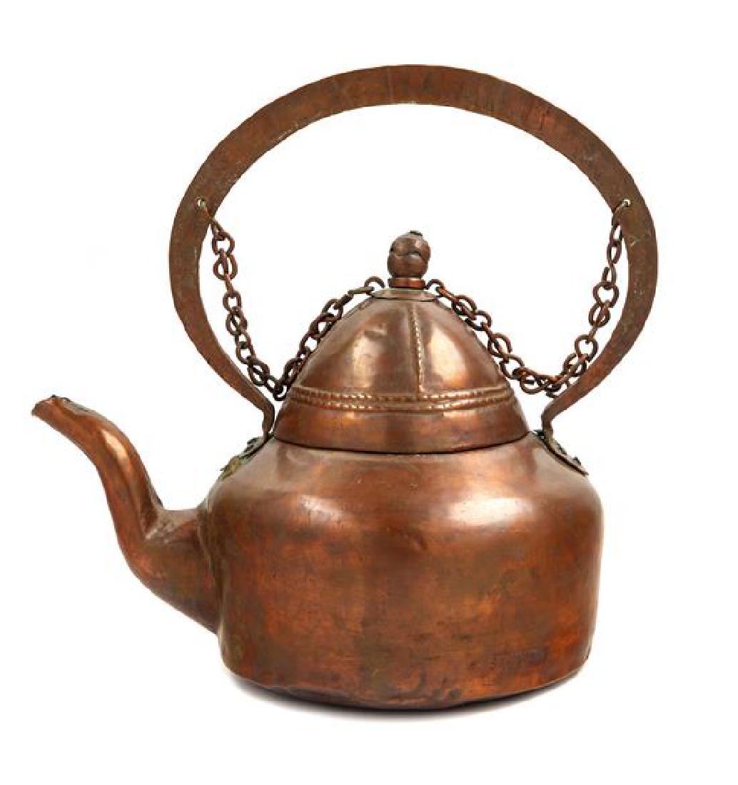 * An Indian Copper Tea Kettle Height 16 inches.: * An Indian Copper Tea Kettle of globular form, with domed lid and acorn finial. Height 16 inches. Estimate $150-250 Property from the Estate of William Lipton, New York, New York