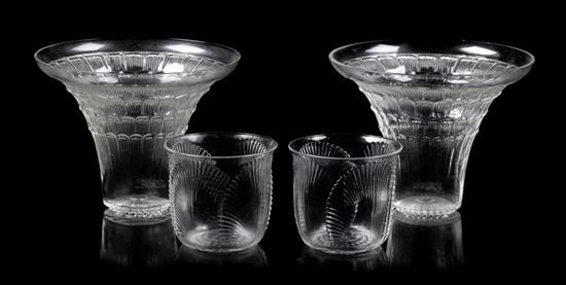 * A Pair of Lalique Glasses and a Pair of Shot Glasses: * A Pair of Lalique Glasses and a Pair of Shot Glasses the larger glasses etched R.LALIQUE FRANCE and the smaller glasses etched R. Lalique, France. Height of tallest 3 1/8 inches. Estimate $60-80 Pro