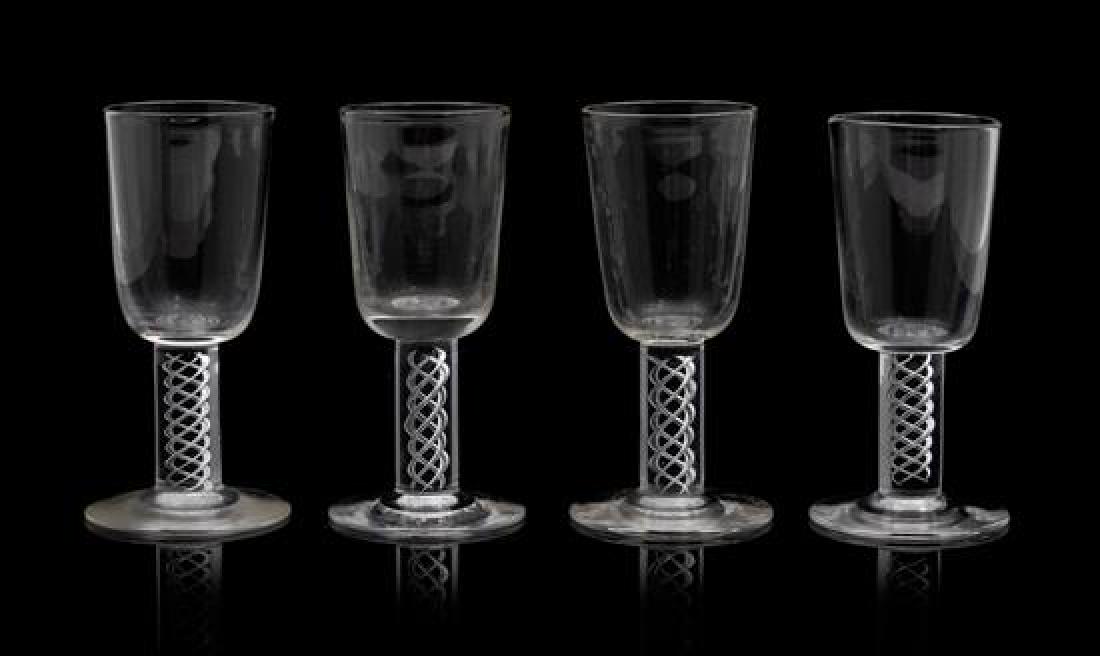* A Set of Eighteen Steuben Liqueurs Height 3 7/8: * A Set of Eighteen Steuben Liqueurs each with spiral twist stems. Height 3 7/8 inches. Estimate $500-700 Property from the Estate of William Lipton, New York, New York