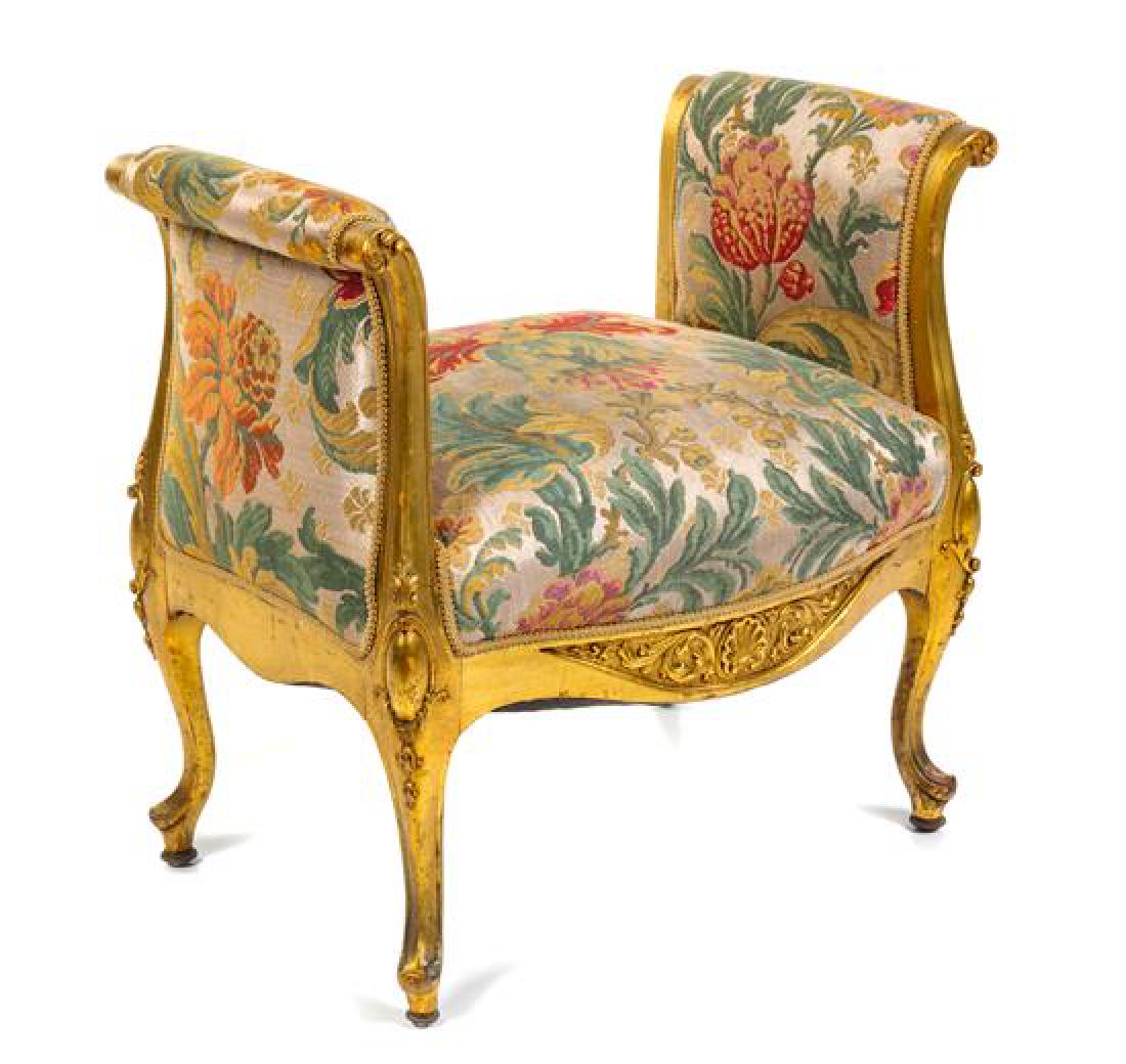 A Louis XV Style Giltwood Window Seat Width 28 1/2: A Louis XV Style Giltwood Window Seat 19th century having an upholstered arms and seat, raised on cabriole legs. Width 28 1/2 inches. Estimate $300-500