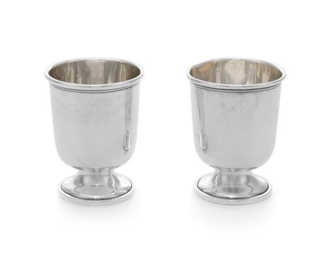 A Pair of American Silver Shot Glasses, Second Half: A Pair of American Silver Shot Glasses Second Half 20th Century each of footed form. marked 'Sterling' on underside 2 ozt 12 dwts Height 2 1//2 inches. Estimate $40-60