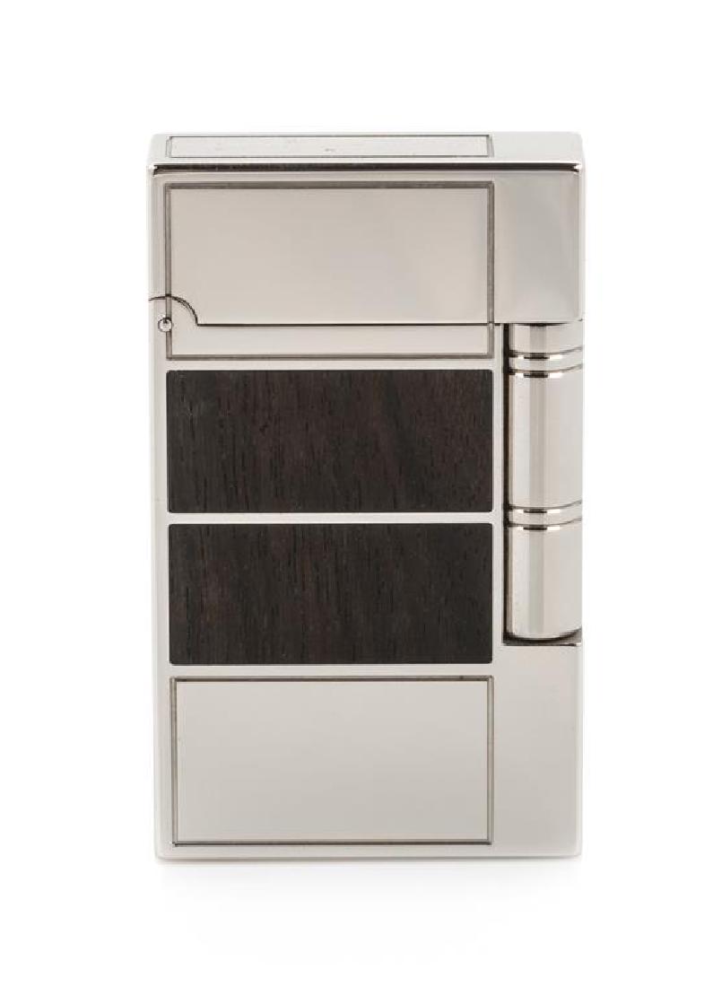 An S.T. Dupont Inspiration Nature: Ebony Limited: An S.T. Dupont Inspiration Nature: Ebony Limited Edition Line 2 Platinum and Ebony Inset Pocket Lighter numbered 598/2000, with a display box, outer box and accompanying documentation. Height 2 1/2 in