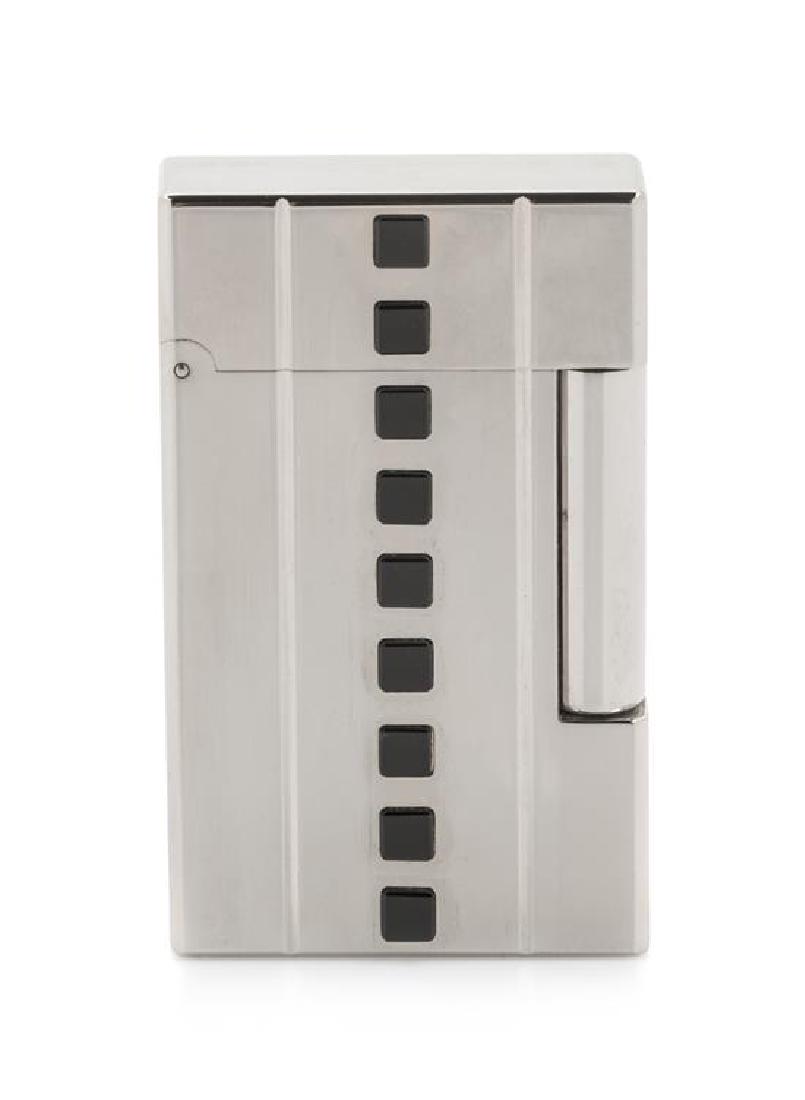 An S.T. Dupont Night and Light: Night Limited Edition: An S.T. Dupont Night and Light: Night Limited Edition Line 2 Palladium and Onyx Inset Pocket Lighter numbered 889/2000, having a display box, an outer box with a sleeve and accompanying documentation.