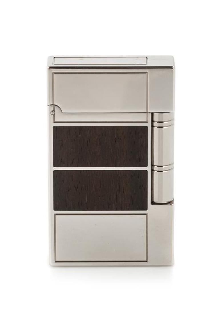 An S.T. Dupont Inspiration Nature: Ebony Limited: An S.T. Dupont Inspiration Nature: Ebony Limited Edition Line 2 Platinum and Ebony Inset Pocket Lighter numbered 109/2000, having a display box, an outer box with a sleeve and accompanying documentati